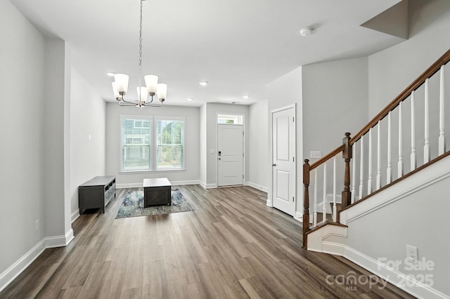334 Ladybird Ln, Pineville, NC 28134 - foyer entrance with stairway, wood finished floors, a chandelier, and recessed lighting