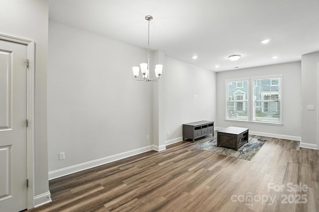 334 Ladybird Ln, Pineville, NC 28134 - unfurnished dining area with dark wood finished floors, a chandelier, and recessed lighting