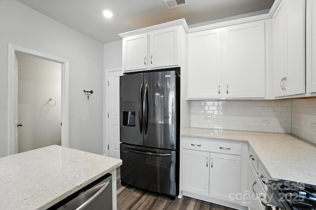 334 Ladybird Ln, Pineville, NC 28134 - kitchen with refrigerator with ice dispenser, decorative backsplash, dark wood-style floors, white cabinets, and light stone countertops