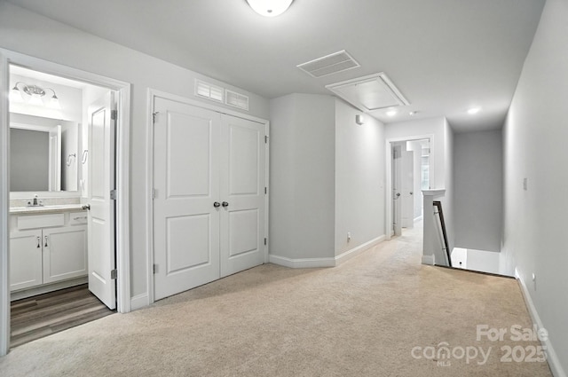 334 Ladybird Ln, Pineville, NC 28134 - hall with an upstairs landing, attic access, and carpet flooring