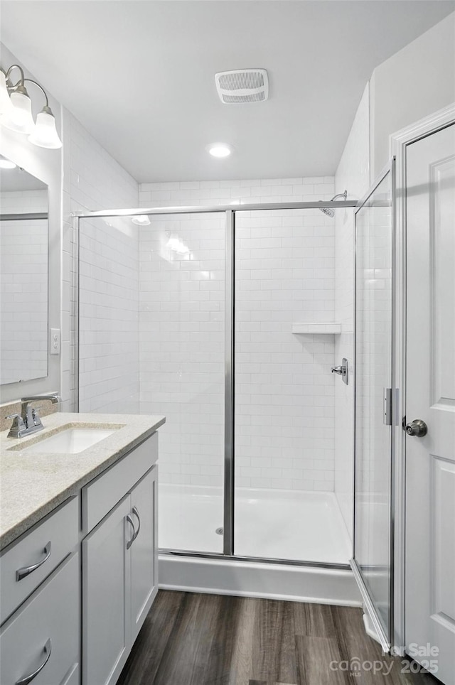 334 Ladybird Ln, Pineville, NC 28134 - full bath featuring vanity, wood finished floors, and a shower stall