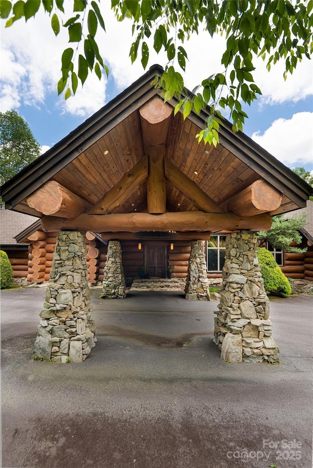 303 Flying Hawk Trl, Waynesville, NC 28786 - property entrance with log exterior