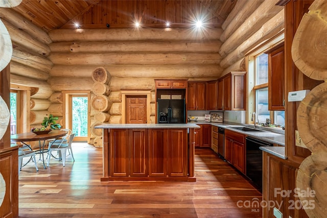 303 Flying Hawk Trl, Waynesville, NC 28786 - kitchen with black appliances, hardwood / wood-style flooring, wood ceiling, a center island, and rustic walls