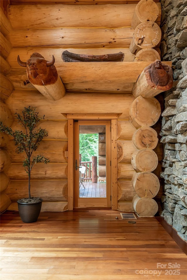 303 Flying Hawk Trl, Waynesville, NC 28786 - detailed view of wood finished floors and log walls