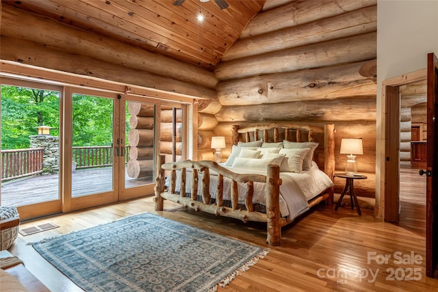 303 Flying Hawk Trl, Waynesville, NC 28786 - bedroom with access to outside, wood ceiling, light wood-type flooring, log walls, and lofted ceiling