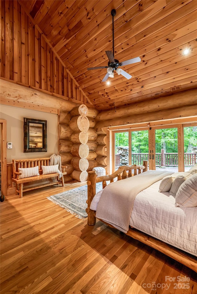 303 Flying Hawk Trl, Waynesville, NC 28786 - bedroom featuring wood ceiling, multiple windows, log walls, hardwood / wood-style flooring, and high vaulted ceiling
