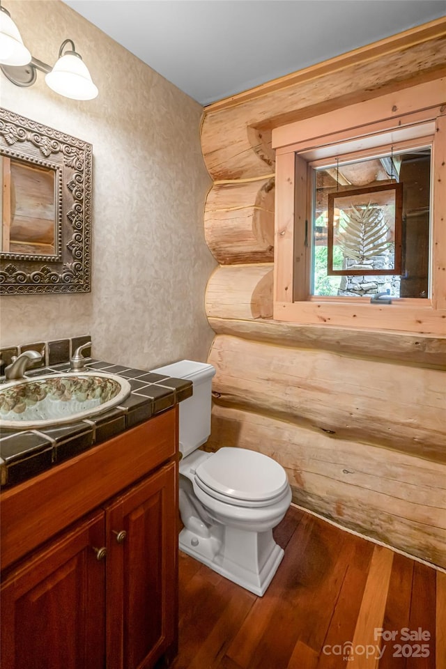 303 Flying Hawk Trl, Waynesville, NC 28786 - half bathroom featuring wood-type flooring and vanity