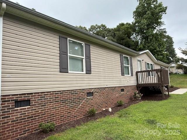 2418 6th Ave SW, Hickory, NC 28602 - view of home's exterior with a deck, a lawn, and crawl space
