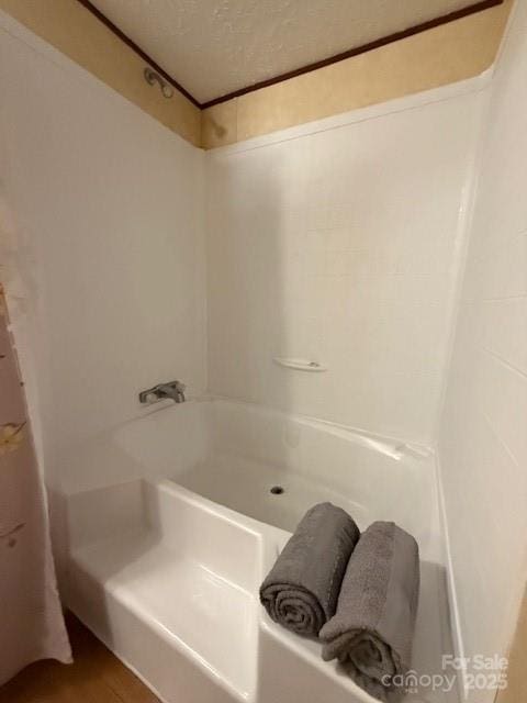 2418 6th Ave SW, Hickory, NC 28602 - full bathroom with a textured ceiling and tub / shower combination