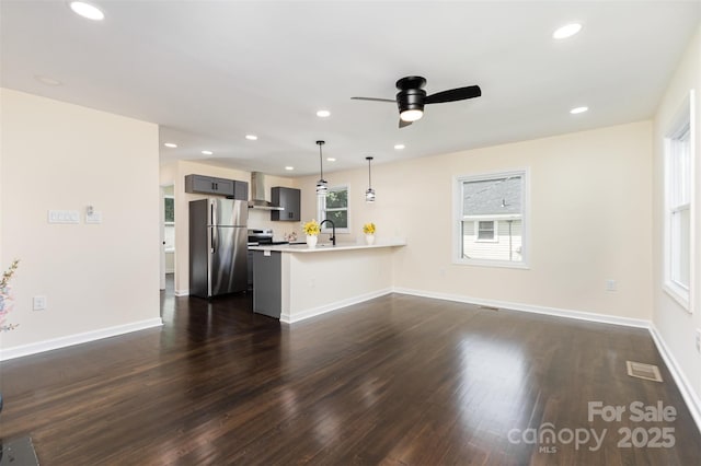 803 Irene Ave, Kannapolis, NC 28083 - unfurnished living room with dark wood-type flooring, a ceiling fan, and recessed lighting