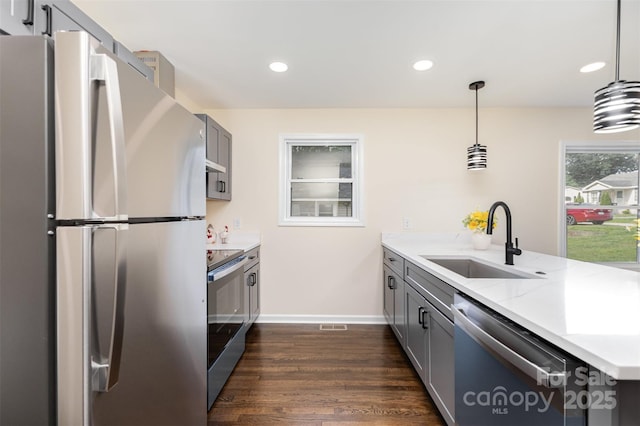 803 Irene Ave, Kannapolis, NC 28083 - kitchen with appliances with stainless steel finishes, a peninsula, gray cabinets, dark wood-type flooring, and recessed lighting
