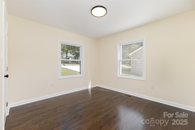 803 Irene Ave, Kannapolis, NC 28083 - unfurnished room with dark wood finished floors and baseboards