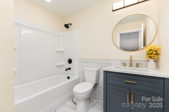 803 Irene Ave, Kannapolis, NC 28083 - bathroom with vanity,  shower combination, tile walls, marble look tiles, and wainscoting