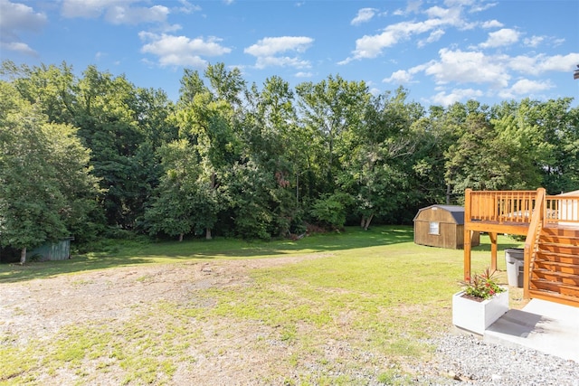 803 Irene Ave, Kannapolis, NC 28083 - view of grassy yard with a storage shed, stairway, and a deck