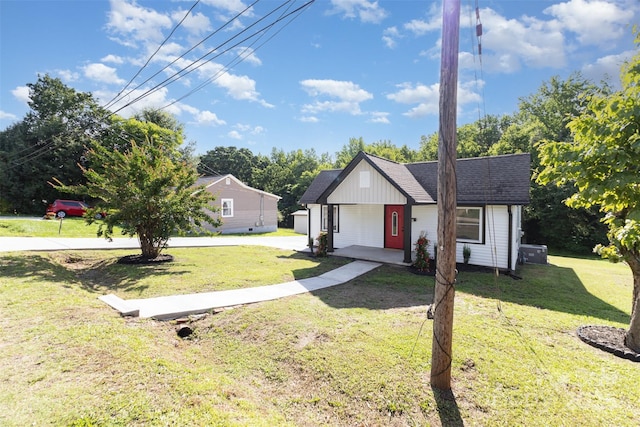 803 Irene Ave, Kannapolis, NC 28083 - view of front facade with a front yard, covered porch, and a shingled roof