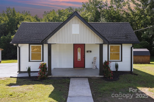 803 Irene Ave, Kannapolis, NC 28083 - view of front of property featuring a porch, board and batten siding, a front yard, and roof with shingles