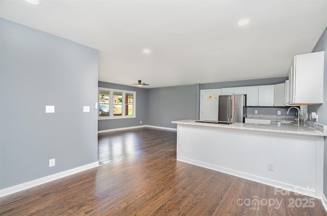 159 Potato House Rd, Lawndale, NC 28090 - kitchen featuring freestanding refrigerator, a peninsula, dark wood finished floors, recessed lighting, and white cabinetry
