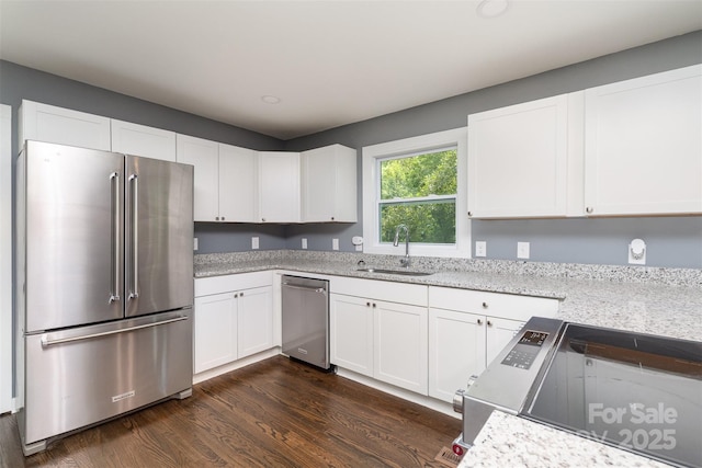 159 Potato House Rd, Lawndale, NC 28090 - kitchen with stainless steel appliances, white cabinetry, dark wood-style flooring, and light stone countertops