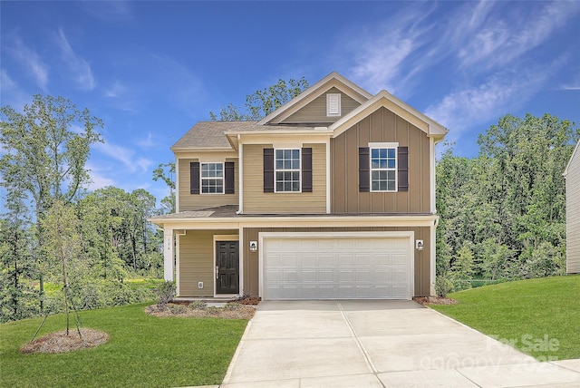 136 Dorian Pl, Troutman, NC 28166 - view of front of house with board and batten siding, driveway, an attached garage, and a front lawn