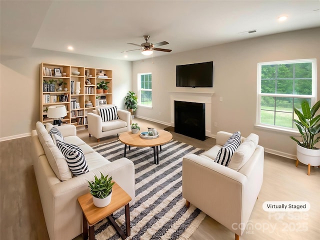 2382 Drake Mill Ln SW, Concord, NC 28025 - living room with a ceiling fan, wood finished floors, a fireplace with flush hearth, and recessed lighting