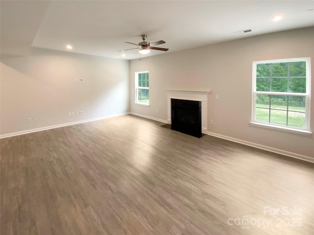 2382 Drake Mill Ln SW, Concord, NC 28025 - unfurnished living room featuring recessed lighting, a ceiling fan, wood finished floors, and a fireplace with flush hearth