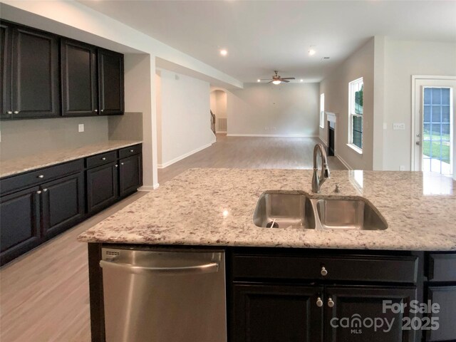 2382 Drake Mill Ln SW, Concord, NC 28025 - kitchen with dishwasher, a ceiling fan, light wood-style floors, open floor plan, and dark cabinets