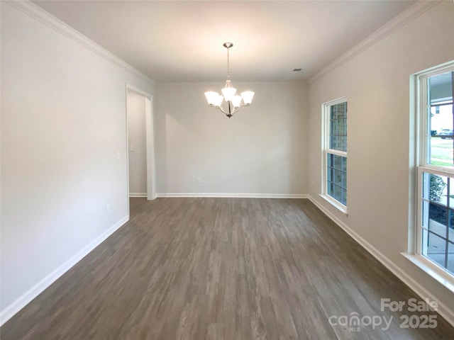 2382 Drake Mill Ln SW, Concord, NC 28025 - empty room with a chandelier, dark wood-style floors, and crown molding