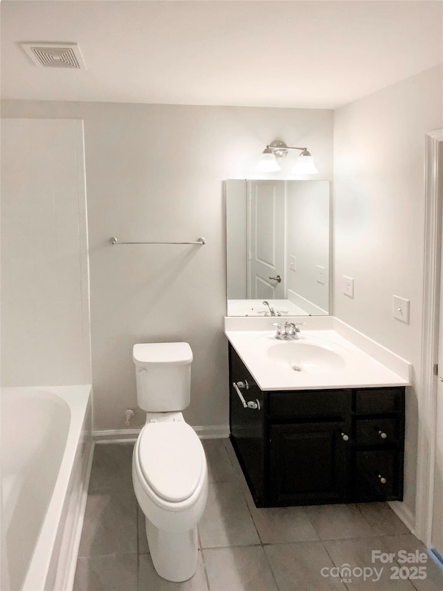 2382 Drake Mill Ln SW, Concord, NC 28025 - bathroom featuring vanity, tile patterned floors, and a bath