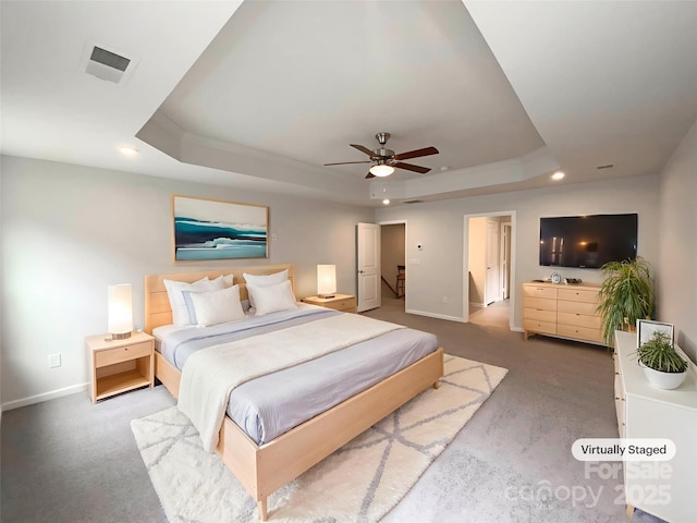 2382 Drake Mill Ln SW, Concord, NC 28025 - carpeted bedroom with a tray ceiling, recessed lighting, and ceiling fan