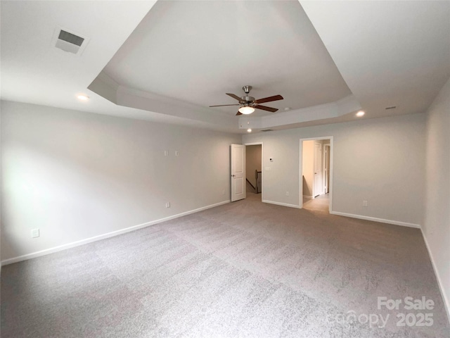 2382 Drake Mill Ln SW, Concord, NC 28025 - unfurnished room featuring a raised ceiling, ceiling fan, recessed lighting, and carpet