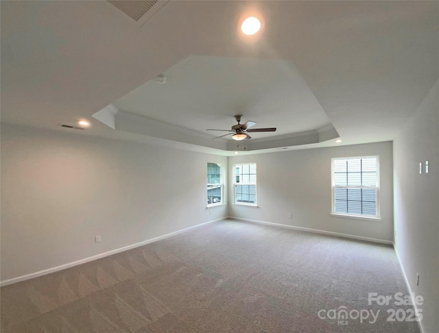 2382 Drake Mill Ln SW, Concord, NC 28025 - carpeted empty room featuring a tray ceiling, a ceiling fan, healthy amount of natural light, recessed lighting, and ornamental molding