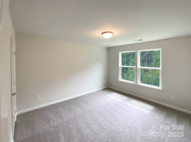 2382 Drake Mill Ln SW, Concord, NC 28025 - spare room featuring carpet flooring and baseboards