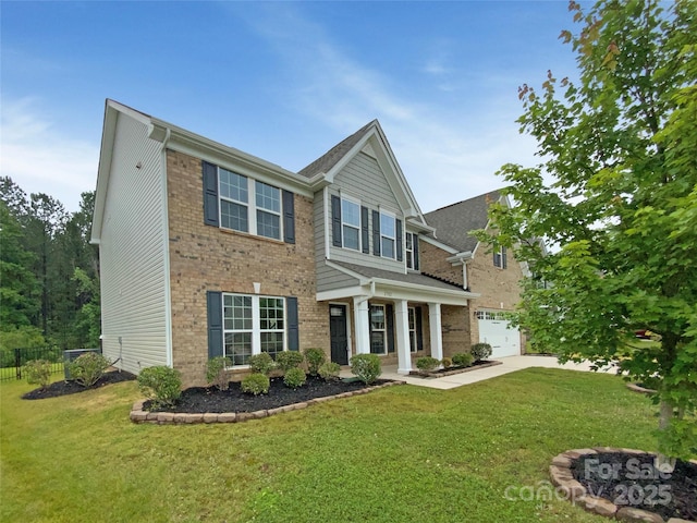 2382 Drake Mill Ln SW, Concord, NC 28025 - view of front facade featuring brick siding, a garage, concrete driveway, and a fire pit