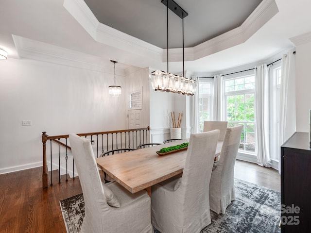 3036 Luke Crossing Dr, Charlotte, NC 28226 - dining area with a raised ceiling, dark wood-style flooring, and ornamental molding