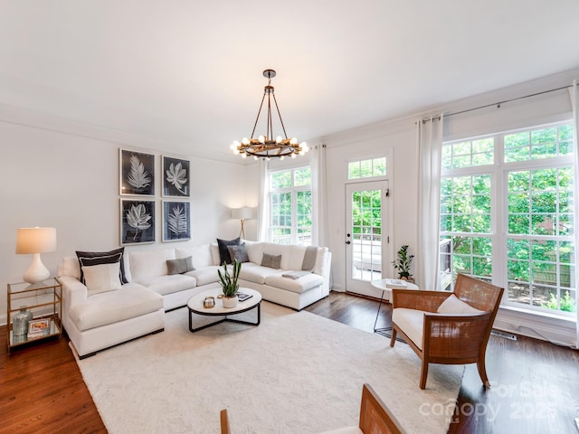 3036 Luke Crossing Dr, Charlotte, NC 28226 - living area with a chandelier and dark wood-style floors