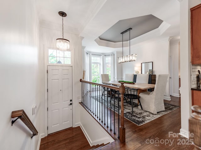 3036 Luke Crossing Dr, Charlotte, NC 28226 - foyer entrance with a chandelier, ornamental molding, wood finished floors, and a tray ceiling