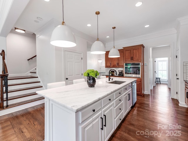 3036 Luke Crossing Dr, Charlotte, NC 28226 - kitchen featuring stainless steel appliances, brown cabinetry, tasteful backsplash, a center island with sink, and light stone countertops