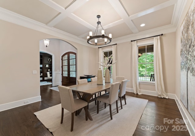 408 Covington Xing, Matthews, NC 28104 - dining room featuring arched walkways, a chandelier, coffered ceiling, dark wood-style flooring, and ornamental molding