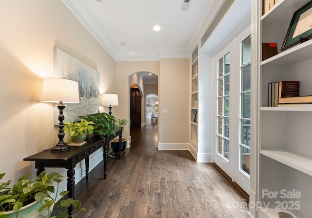 408 Covington Xing, Matthews, NC 28104 - hall with arched walkways, ornamental molding, dark wood-type flooring, and built in shelves