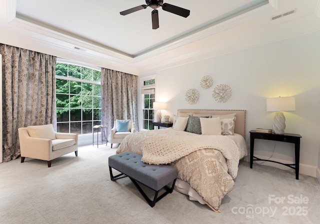 408 Covington Xing, Matthews, NC 28104 - bedroom featuring a tray ceiling, ornamental molding, light carpet, and ceiling fan