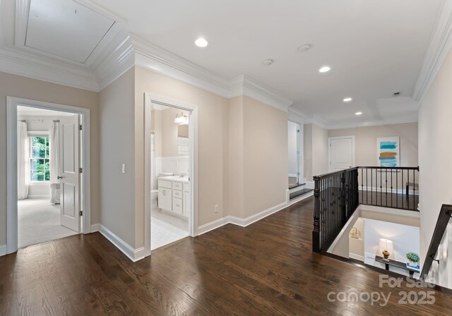 408 Covington Xing, Matthews, NC 28104 - corridor featuring an upstairs landing, dark wood-style flooring, attic access, recessed lighting, and ornamental molding