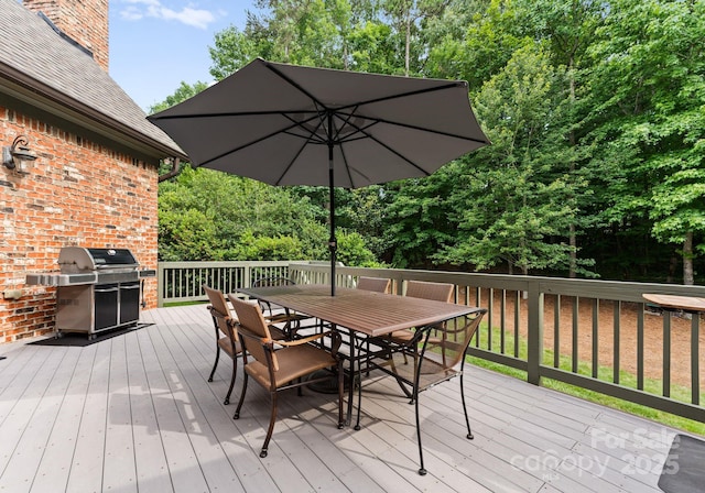 408 Covington Xing, Matthews, NC 28104 - wooden deck featuring a grill and outdoor dining area