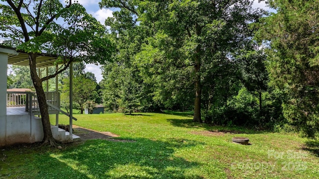 921 Spencer Rd NE, Conover, NC 28613 - view of grassy yard featuring a wooden deck