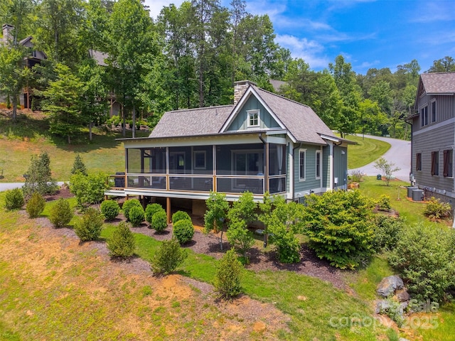 396 River Club Dr, Cullowhee, NC 28723 - rear view of property featuring a sunroom, a chimney, and roof with shingles