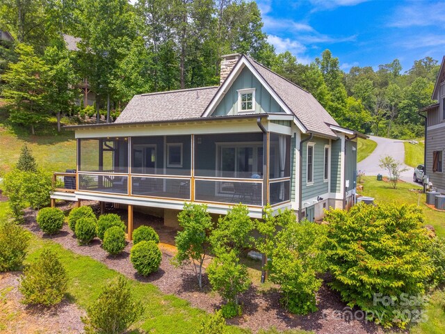 396 River Club Dr, Cullowhee, NC 28723 - back of property with a chimney, roof with shingles, and a sunroom