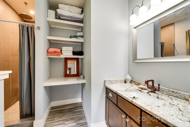 396 River Club Dr, Cullowhee, NC 28723 - full bathroom with a shower stall, vanity, and wood finished floors