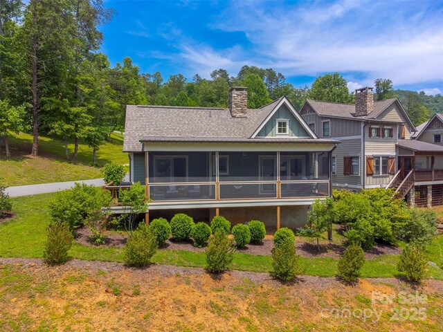 396 River Club Dr, Cullowhee, NC 28723 - rear view of property with a sunroom, a chimney, and roof with shingles
