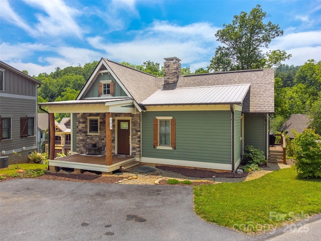 396 River Club Dr, Cullowhee, NC 28723 - view of front of home featuring a chimney, covered porch, and a front lawn