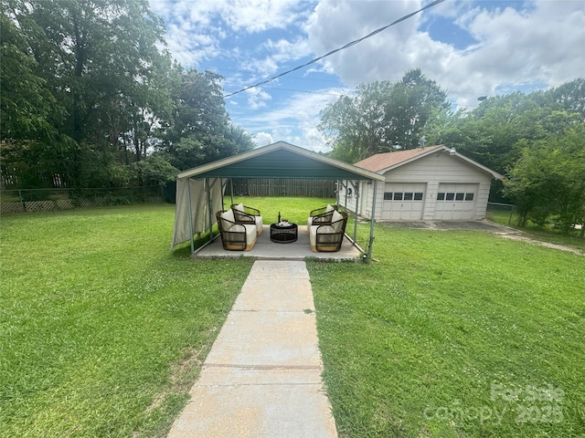 1107 Crestfield Dr, Lancaster, SC 29720 - view of yard with a detached garage, a fire pit, and a patio