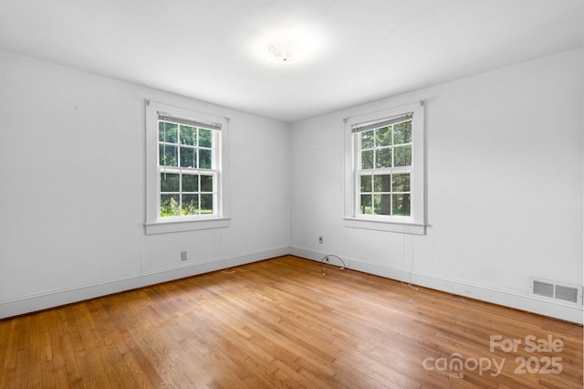1520 21st Ave NE, Hickory, NC 28601 - spare room featuring plenty of natural light and wood finished floors